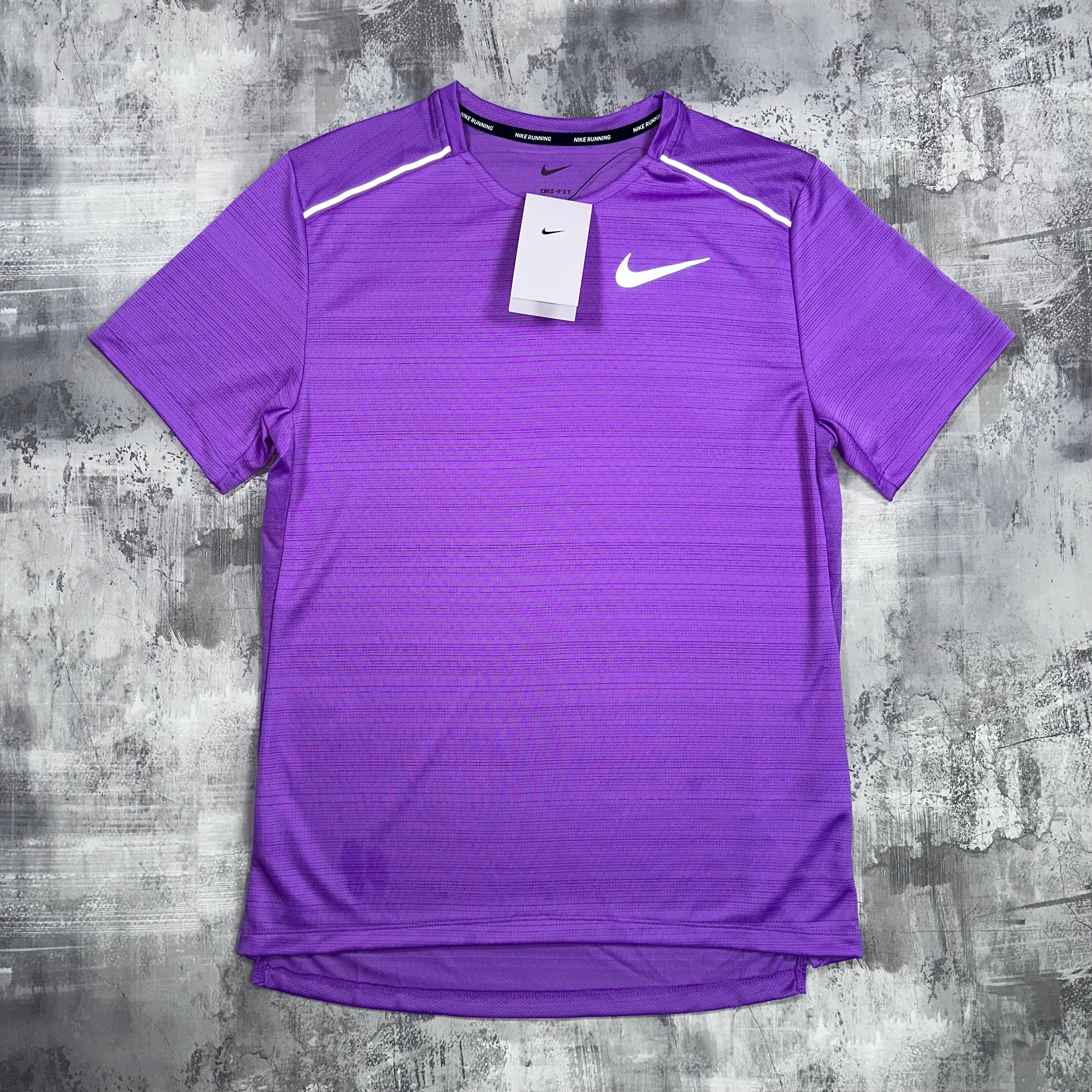The Nike Miler T-Shirt in a purple colour way. This view from the front highlights the breathability and lightweight nature of the top. 