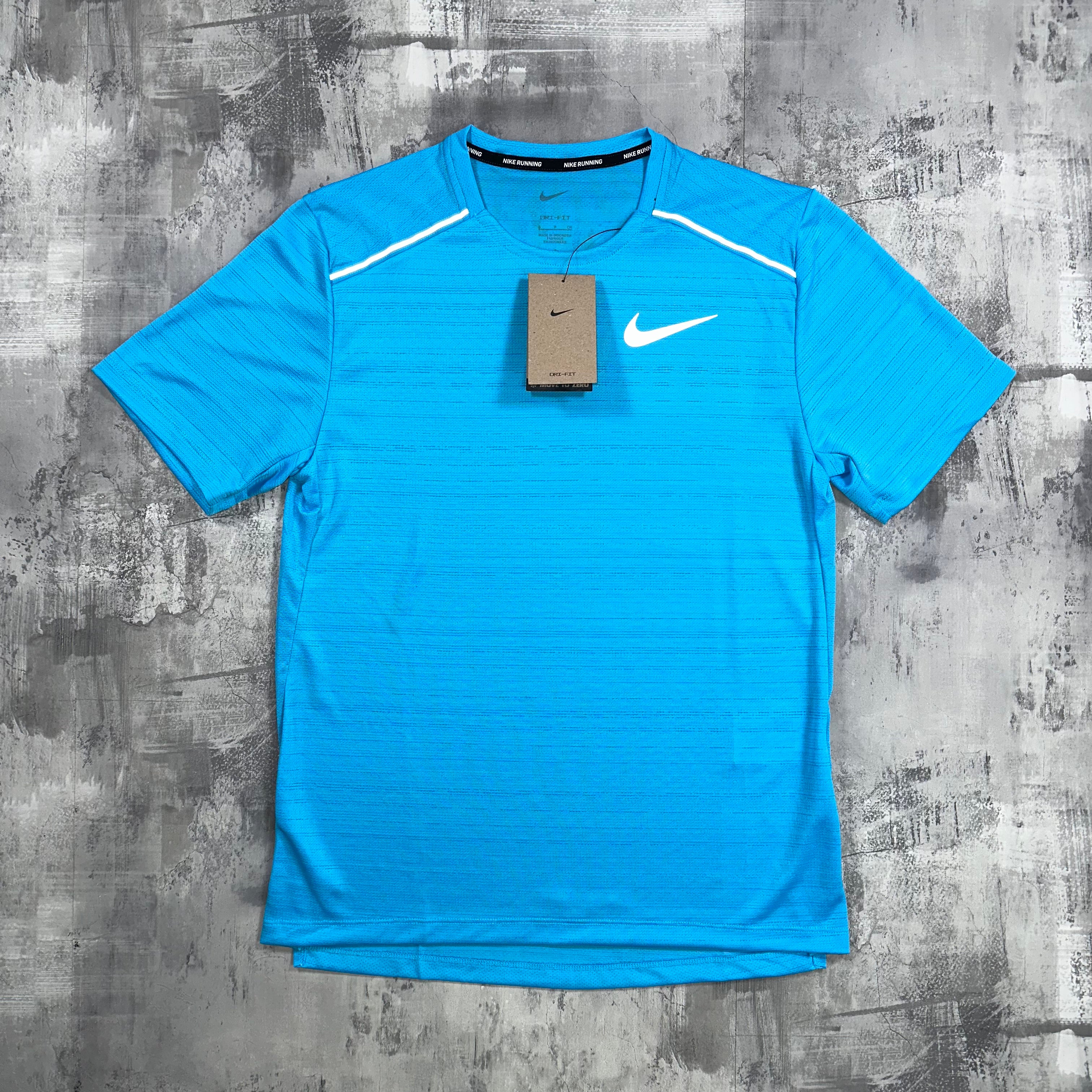 The Nike Miler T-Shirt In Sky Blue. In this angle, you can see the Nike swoosh from the front. 